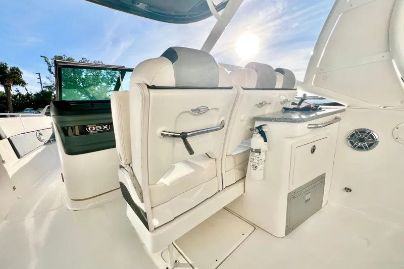 Slide: The Image of 2021 Chaparral 280 OSX boat interior with white seating and built-in speakers. - 18