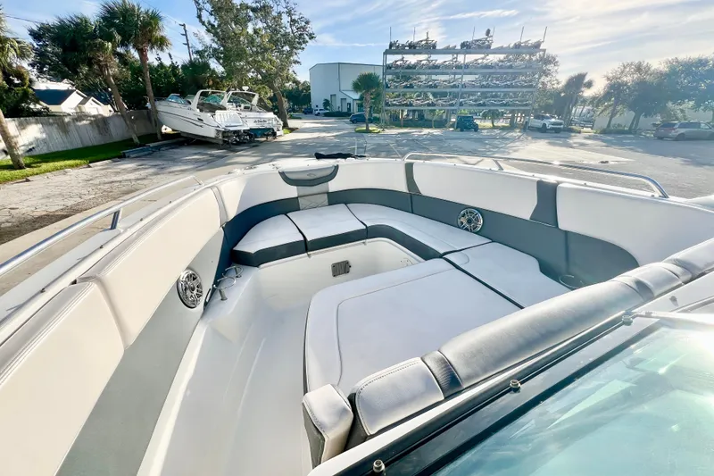 Slide: The Image of 2021 Chaparral 280 OSX boat interior with modern dashboard and seating. - 22