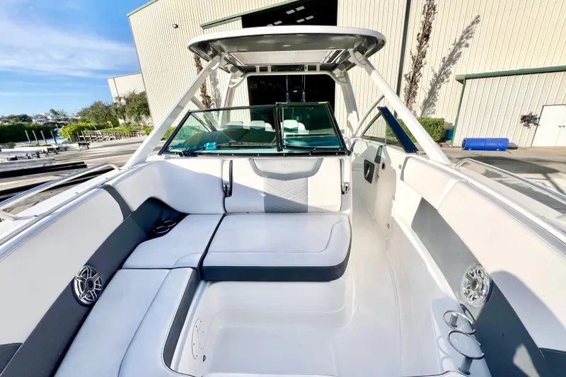 Slide: The Image of 2021 Chaparral 280 OSX boat interior with spacious seating and modern design. - 23