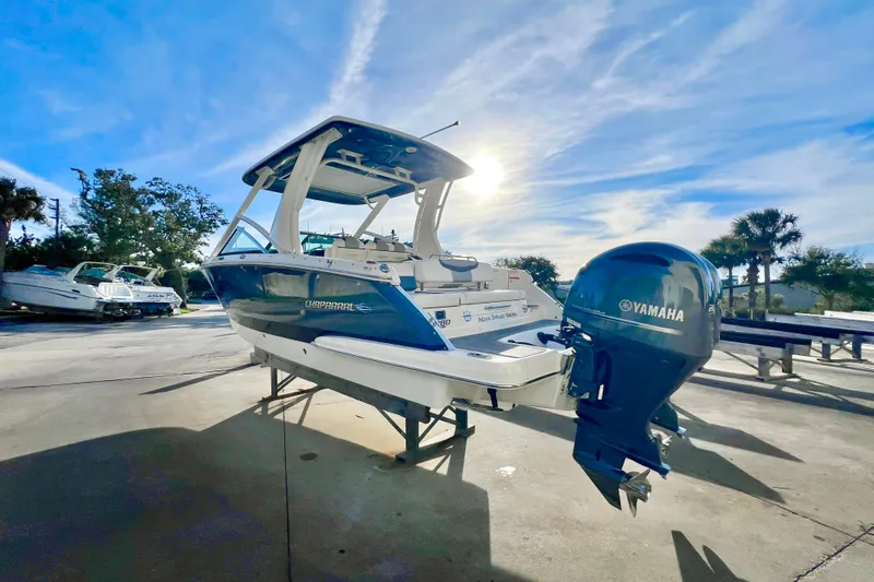 Slide: The Image of 2021 Chaparral 280 OSX boat with dual Yamaha 200 engines at marina. - 5