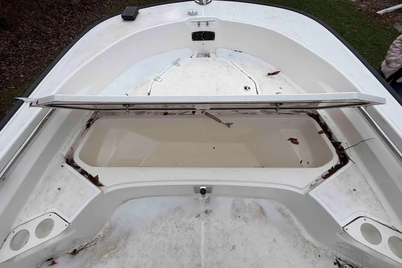 Slide: The Image of Open storage compartment on a 2020 Boston Whaler 190 Montauk boat, showing interior space. - 13
