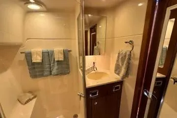 Slide: The Image of 2019 Tiara Yachts 4300 Open bathroom with modern fixtures and elegant design. - 21