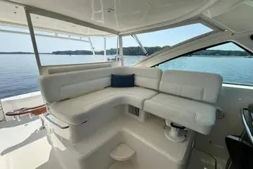 Slide: The Image of 2019 Tiara Yachts 4300 Open with luxurious white seating and scenic water view. - 6