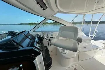 Slide: The Image of 2019 Tiara Yachts 4300 Open helm with modern controls and panoramic water view. - 7
