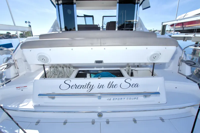 Slide: The Image of 2014 Regal 46 Sport Coupe yacht, "Serenity in the Sea," docked with open storage compartment. - 12