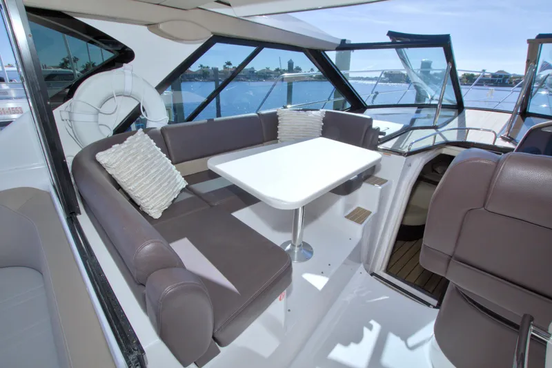 Slide: The Image of Luxurious interior of 2014 Regal 46 Sport Coupe yacht with elegant seating and table. - 29