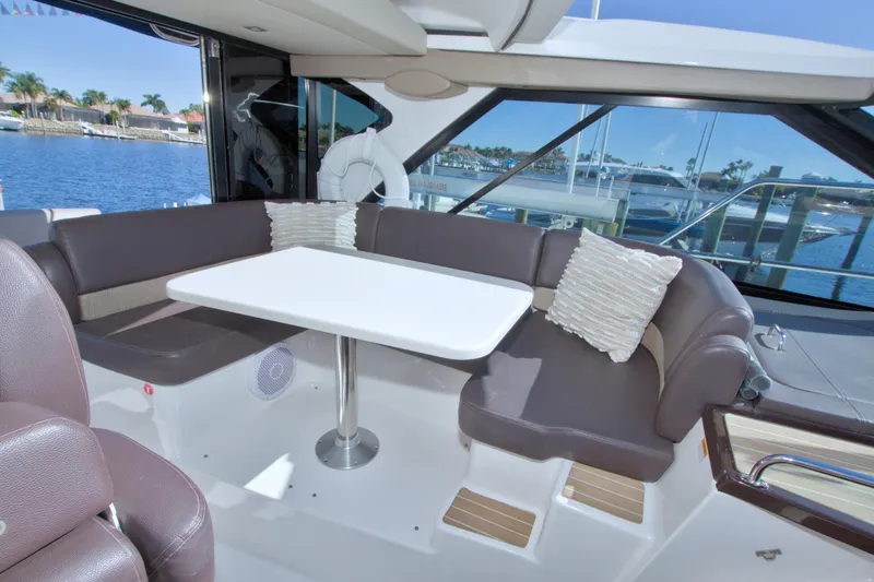 Slide: The Image of Luxurious interior of 2014 Regal 46 Sport Coupe yacht with waterfront view. - 30