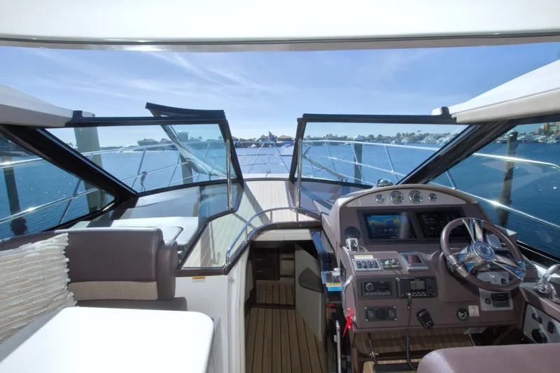 Slide: The Image of Interior view of 2014 Regal 46 Sport Coupe yacht cockpit with ocean backdrop. - 31