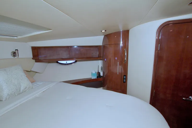 Slide: The Image of Luxurious cabin interior of 2014 Regal 46 Sport Coupe yacht with wood finishes. - 46