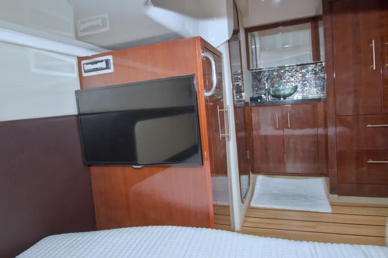 Slide: The Image of Luxurious interior of 2014 Regal 46 Sport Coupe with TV and modern cabinetry. - 55
