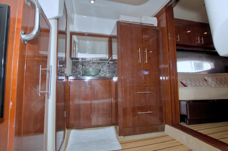 Slide: The Image of Luxurious interior of 2014 Regal 46 Sport Coupe yacht with wood cabinetry and modern fixtures. - 56