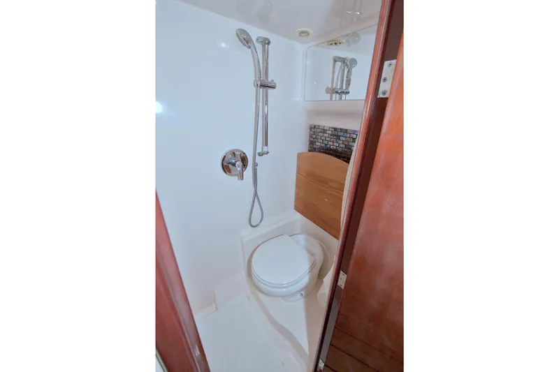 Slide: The Image of 2014 Regal 46 Sport Coupe bathroom with shower and toilet. - 58