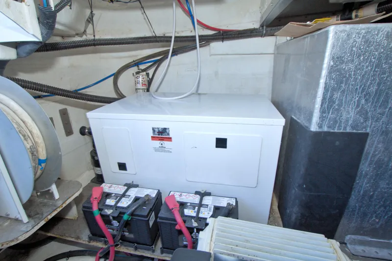 Slide: The Image of Engine room of 2014 Regal 46 Sport Coupe with batteries and equipment. - 67