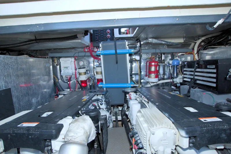 Slide: The Image of Engine room of 2014 Regal 46 Sport Coupe with visible machinery and equipment. - 69