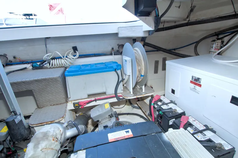 Slide: The Image of Engine room of 2014 Regal 46 Sport Coupe with batteries and equipment. - 78