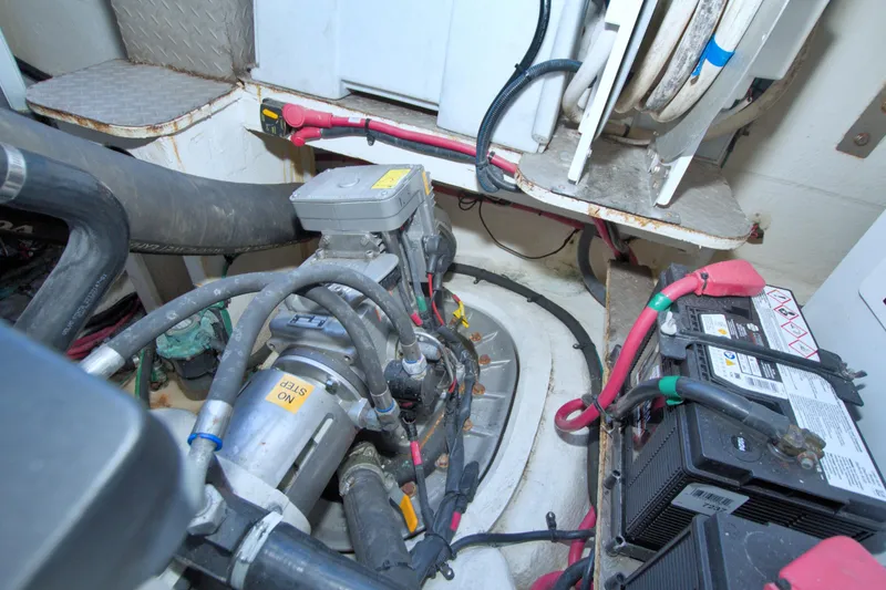 Slide: The Image of Engine room of 2014 Regal 46 Sport Coupe with visible machinery and batteries. - 79