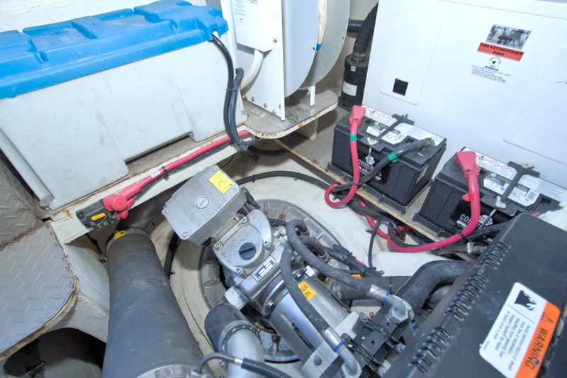 Slide: The Image of Engine compartment of 2014 Regal 46 Sport Coupe with batteries and mechanical components. - 80