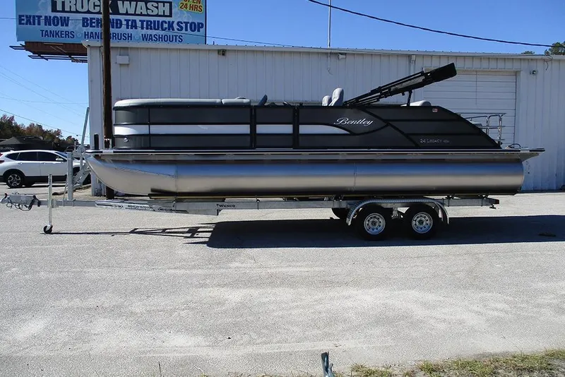 The Image of 2026 Bentley Pontoons Legacy 243 Swingback on trailer, parked outdoors. - 1