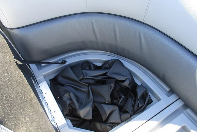 Slide: The Image of Storage compartment in 2026 Bentley Pontoons Legacy 243 Swingback with black cover. - 14