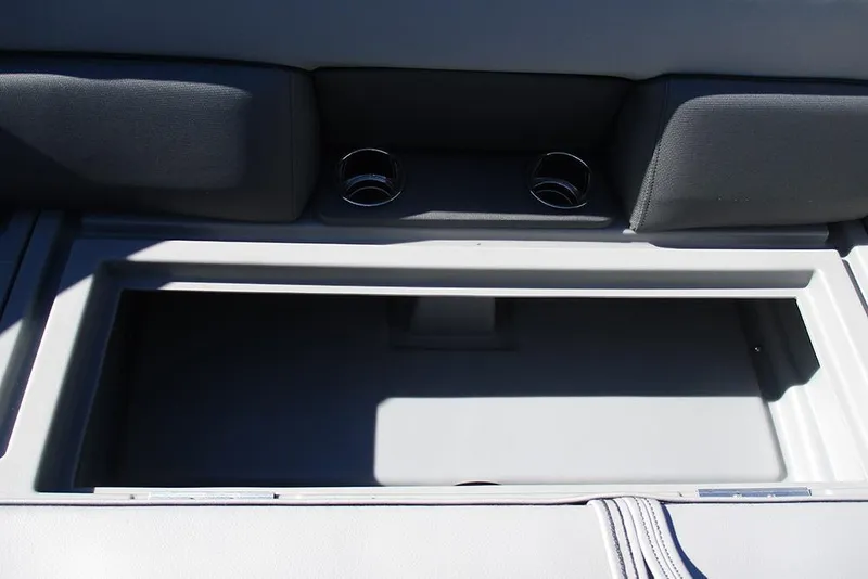 Slide: The Image of 2026 Bentley Pontoons Legacy 243 Swingback storage compartment with cup holders. - 15