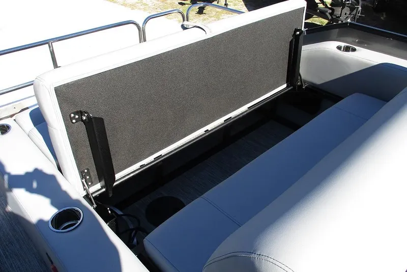 Slide: The Image of 2026 Bentley Pontoons Legacy 243 Swingback seating area with storage compartment open. - 19