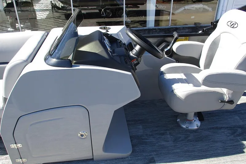 Slide: The Image of 2026 Bentley Pontoons Legacy 243 Swingback helm with steering wheel and captain's chair. - 21