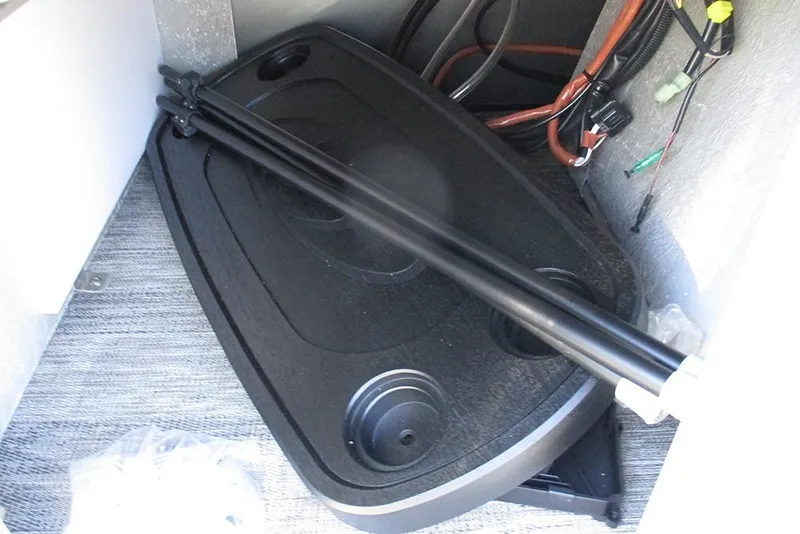 Slide: The Image of 2026 Bentley Pontoons Legacy 243 Swingback interior storage with table and wiring. - 23