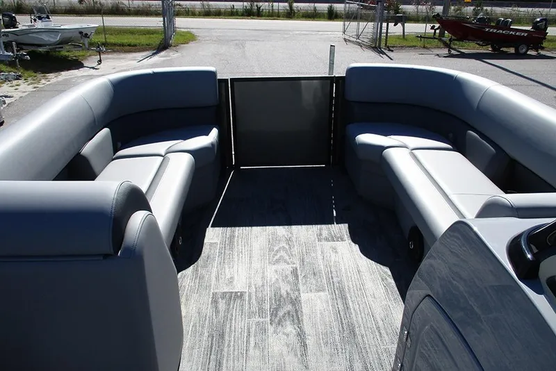 Slide: The Image of 2026 Bentley Pontoons Legacy 243 Swingback interior with gray seating and flooring. - 9