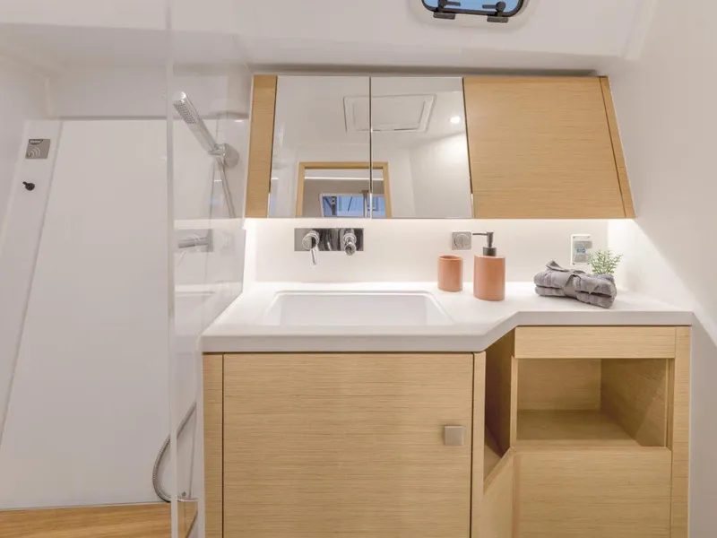 Slide: The Image of Modern bathroom interior of 2025 Hanse 410 yacht with sleek wooden cabinetry. - 19