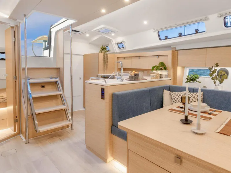 Slide: The Image of Luxurious interior of 2025 Hanse 410 yacht with modern kitchen and dining area. - 23