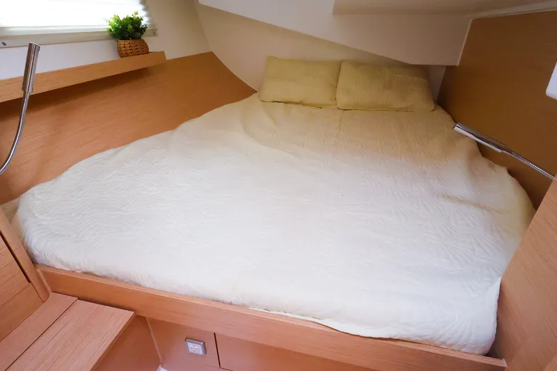 Slide: The Image of Cozy cabin interior of 2025 Hanse 410 yacht with a comfortable bed and modern design. - 14