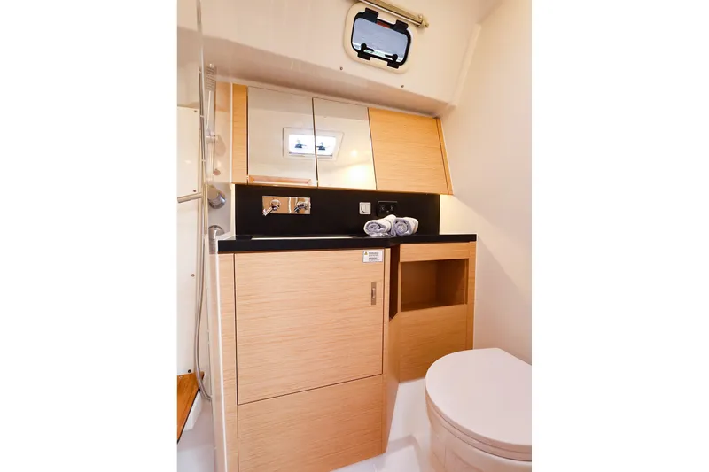 Slide: The Image of Modern bathroom interior of 2025 Hanse 410 yacht with wooden cabinetry and compact design. - 16