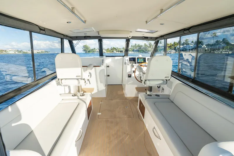 Slide: The Image of Interior of 2026 MJM 3 boat with spacious seating and panoramic windows. - 17