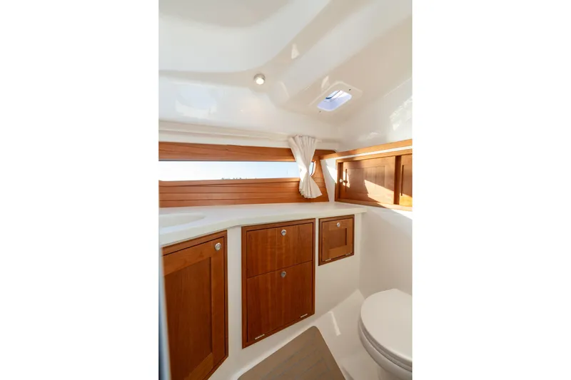 Slide: The Image of 2026 MJM 3 yacht interior with wooden cabinets and compact bathroom design. - 5