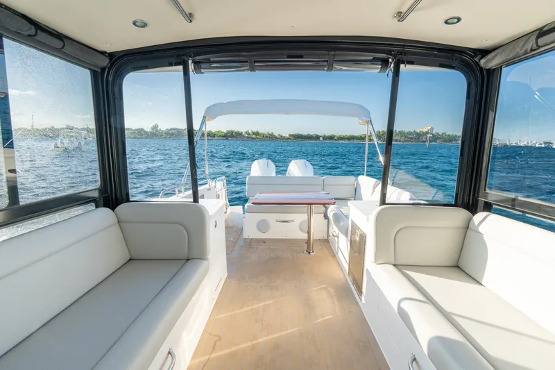 Slide: The Image of Luxurious interior of 2026 MJM 3 yacht with ocean view and comfortable seating. - 21