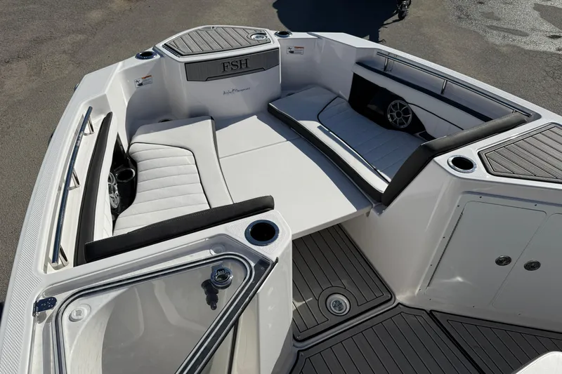 Slide: The Image of 2024 Yamaha Boats 255 FSH Sport H interior with sleek seating and modern design. - 17