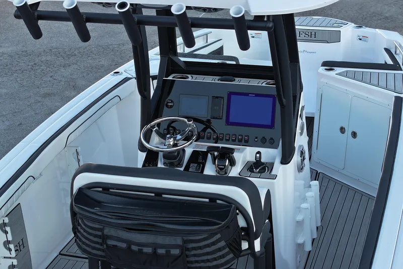Slide: The Image of 2024 Yamaha Boats 255 FSH Sport H cockpit with advanced controls and navigation displays. - 24