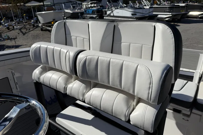 Slide: The Image of 2024 Yamaha Boats 255 FSH Sport H, luxurious white seating detail. - 8