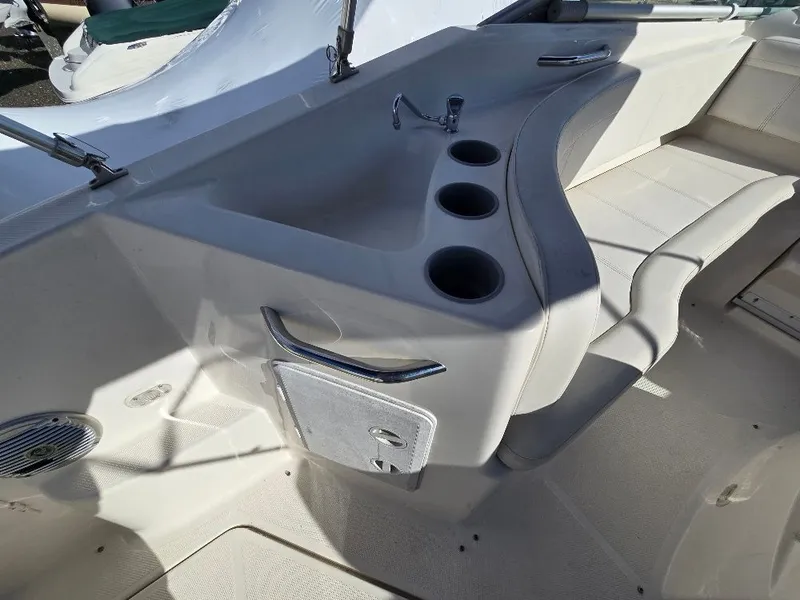 Slide: The Image of Interior of 2011 Bayliner 255 boat with seating and cup holders. - 10