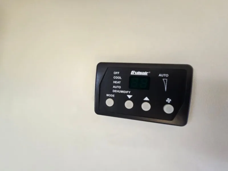 Slide: The Image of Thermostat control panel on 2011 Bayliner 255 boat, featuring cooling and heating options. - 18