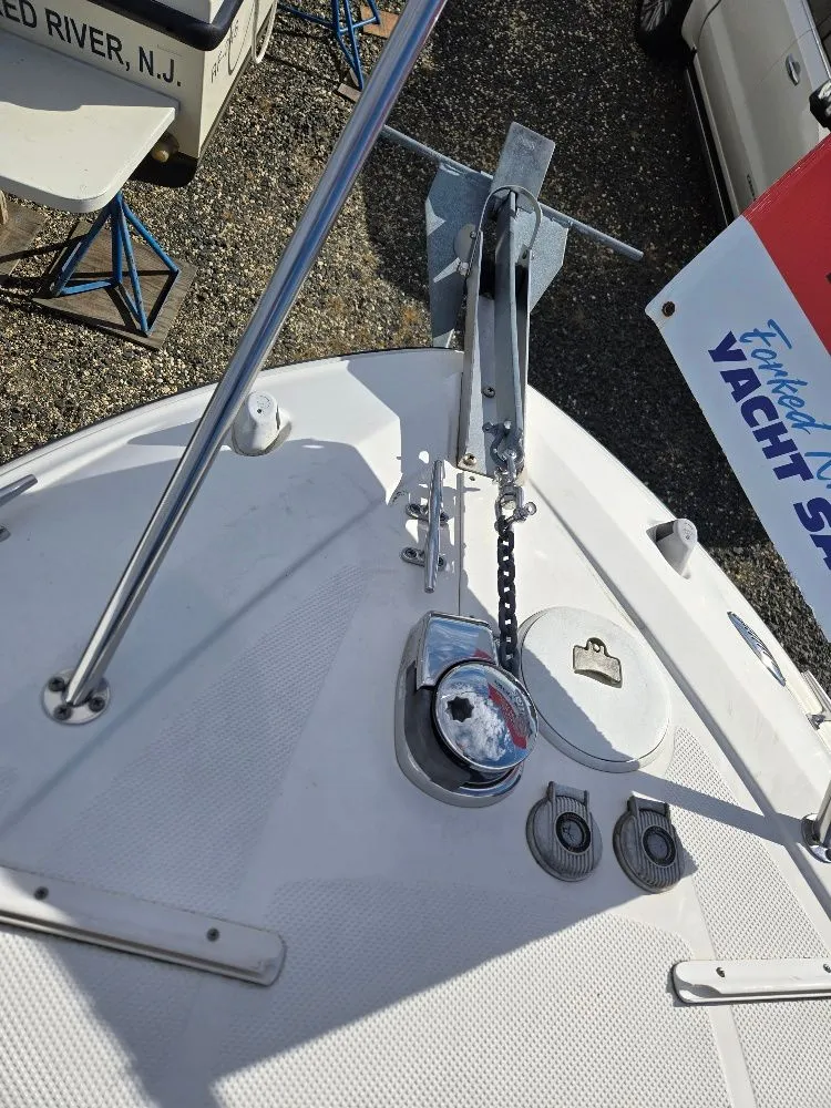Slide: The Image of 2011 Bayliner 255 boat deck with anchor and chain mechanism. - 5