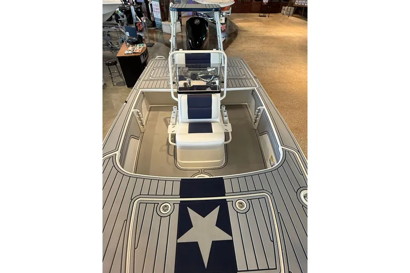 Slide: The Image of 2026 Mako 18 Pro Skiff Patriot Edition boat with star-themed deck design. - 6