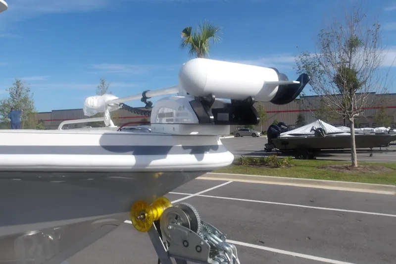 Slide: The Image of 2026 Ranger 2510 Bay boat with mounted equipment in a parking lot. - 3