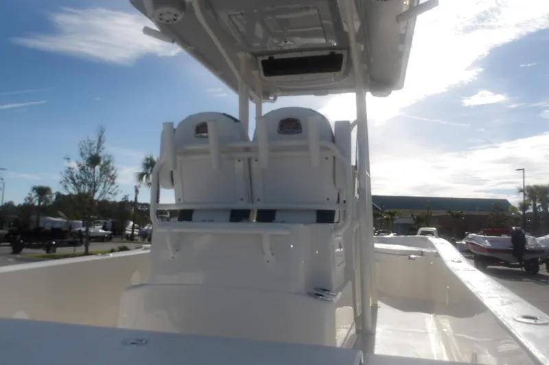 Slide: The Image of 2026 Ranger 2510 Bay boat interior with dual seats and console under a clear sky. - 12