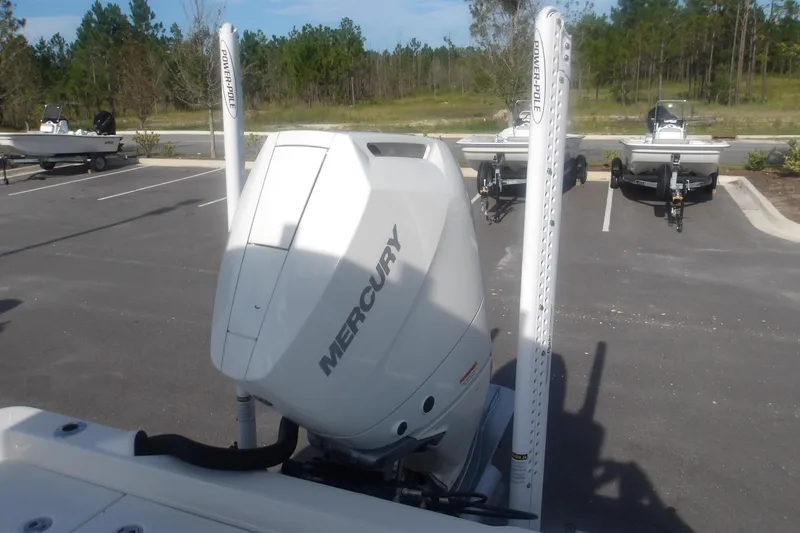 Slide: The Image of 2026 Ranger 2510 Bay boat with Mercury engine and Power-Pole anchors in parking lot. - 34