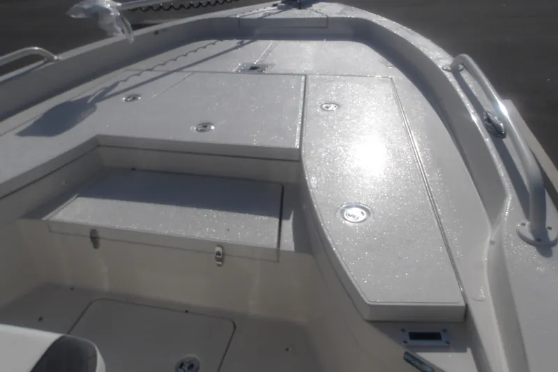 Slide: The Image of 2026 Ranger 2510 Bay boat deck with storage compartments and sleek design. - 24
