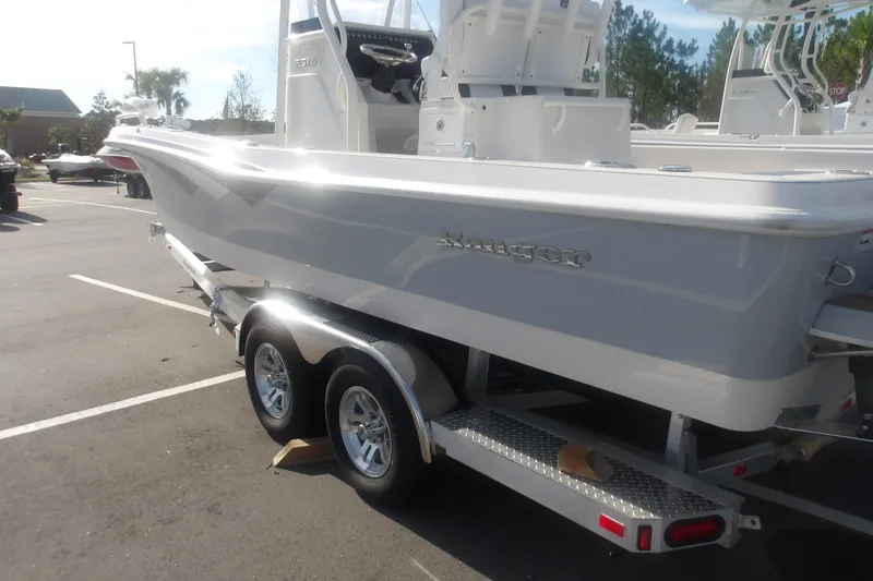 Slide: The Image of 2026 Ranger 2510 Bay boat on trailer in parking lot. - 7