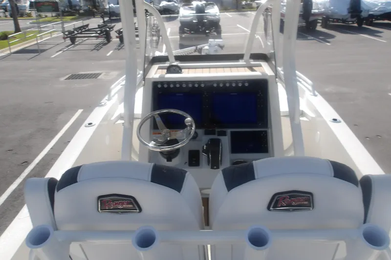 Slide: The Image of 2026 Ranger 2510 Bay boat interior with dual seats and modern dashboard controls. - 17