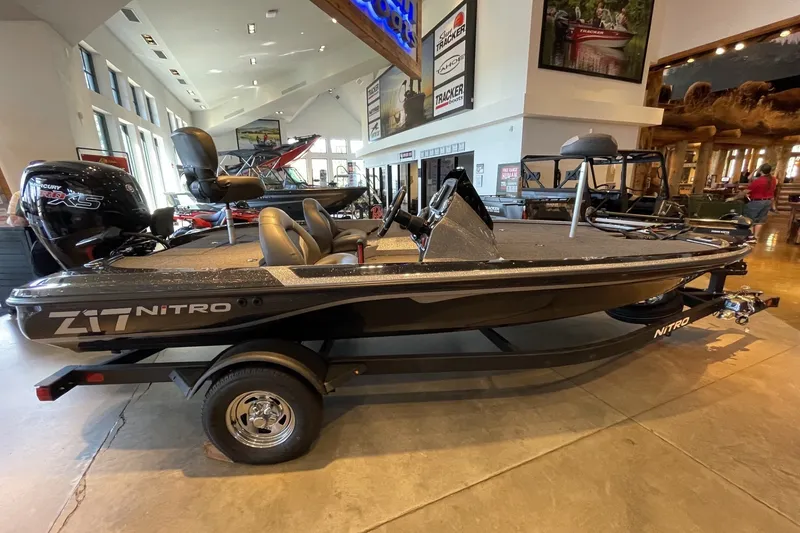 Slide: The Image of 2026 Nitro Z17 boat displayed in a showroom, featuring sleek design and modern amenities. - 3