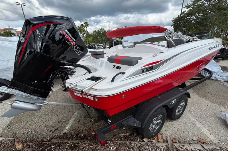 Slide: The Image of 2026 Tahoe T21 boat with Mercury Pro XS engine on a trailer. - 2